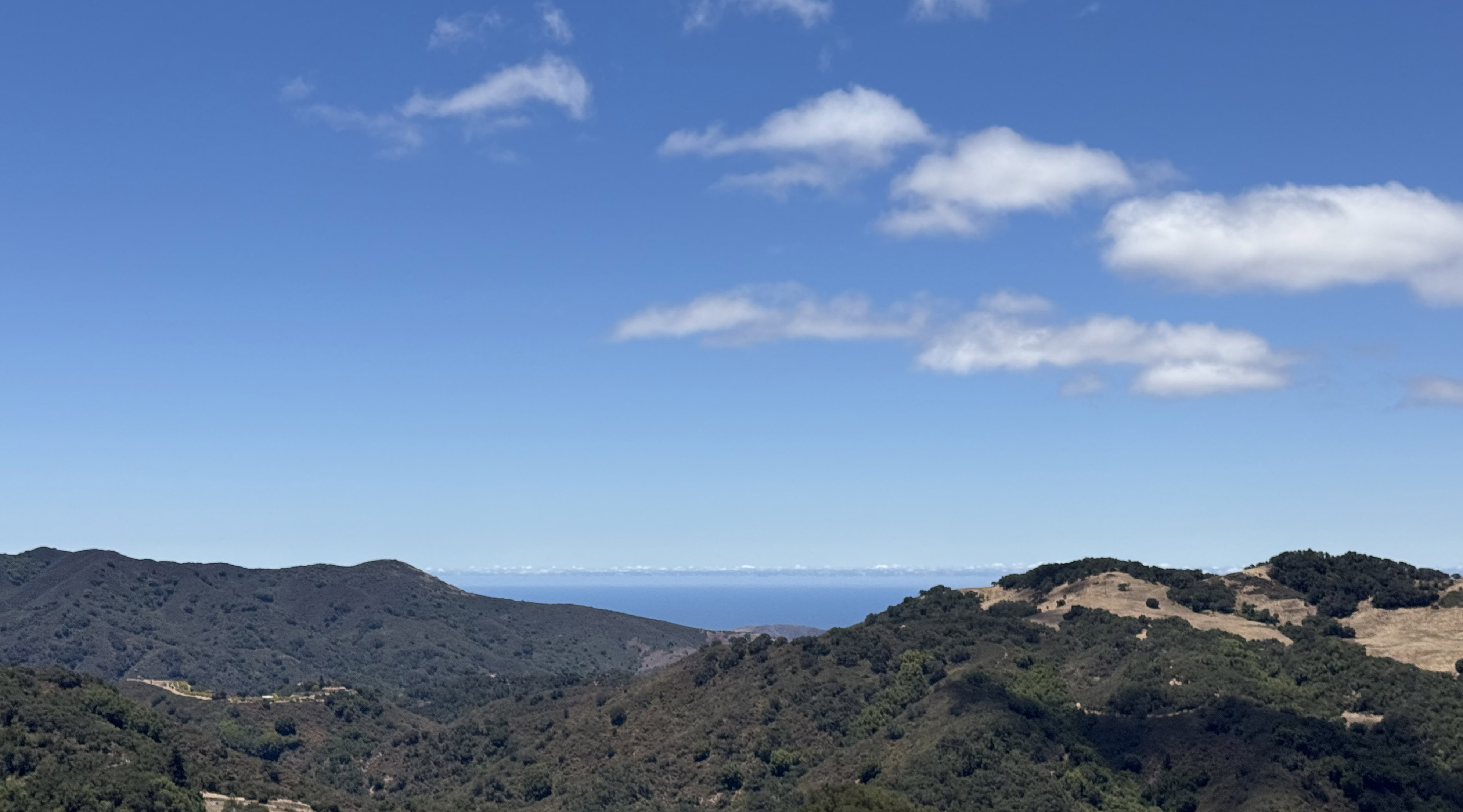 Open blue sky above the mountain landscape at Pullahari