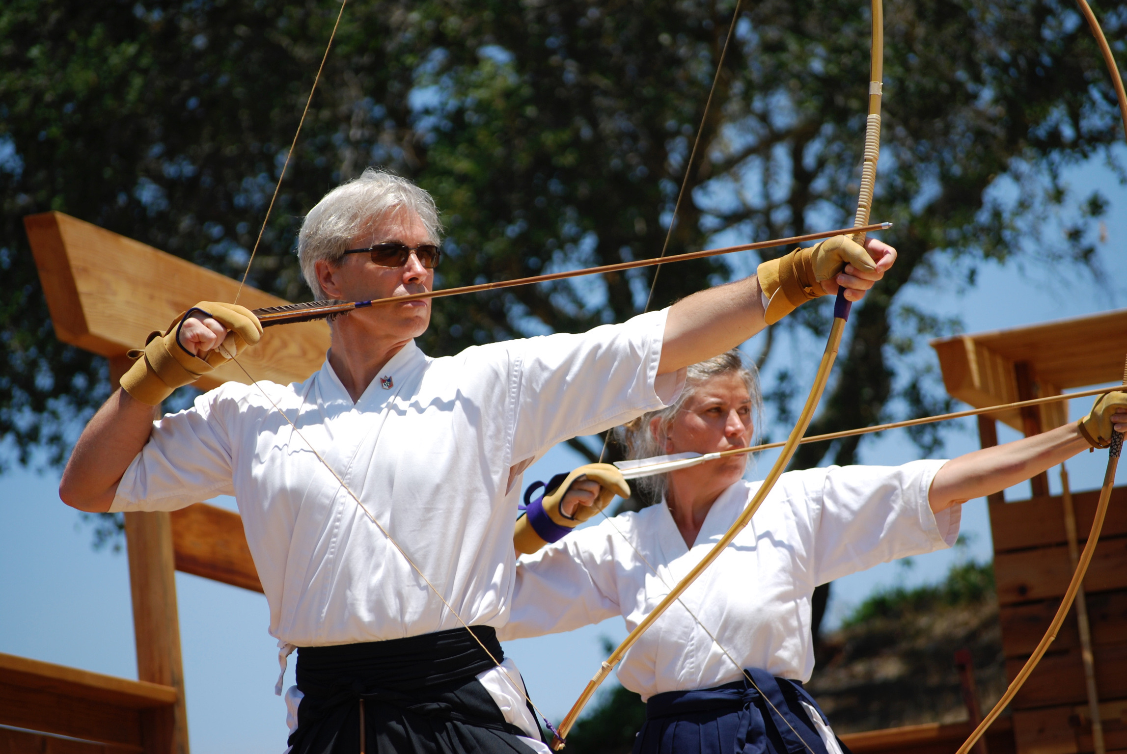 Patrick Sweeney drawing a bow during kyudo practice